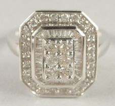 A 14CT WHITE GOLD SQUARE SHAPED DIAMOND RING.