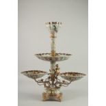 A GOOD BRONZE AND PORCELAIN TABLE CENTREPIECE with cupid supports and painted with birds. 22ins