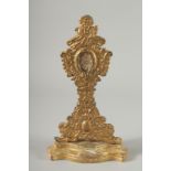 A RARE EARLY ITALIAN GILTWOOD RELIQUANT STAND with Papal seal verso. 11.5ins high.