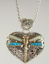 A SILVER GOLD PLATED OPAL DRAGONFLY LOCKET AND CHAIN.