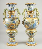 A GOOD LARGE PAIR OF RENAISSANCE STYLE TW HANDLED VASES painted with classical scenes, masks and