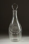 A GEORGIAN GLASS DECANTER AND STOPPER, engraved with ribbons and garlands.