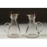 A PAIR OF GLASS SILVER TOP WHISKY TOTS Birmingham 1924.