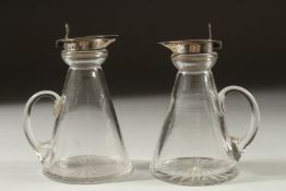 A PAIR OF GLASS SILVER TOP WHISKY TOTS Birmingham 1924.