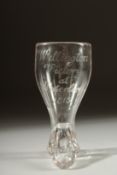 A SMALL GEORGIAN GLASS shaped as a boot, engraved "Wellington Victory at Waterloo, 1815". 3.5ins