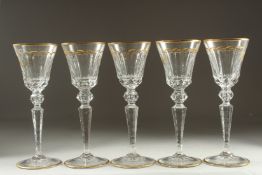 A GOOD SET OF FIVE BACCARAT CUT GLASS AND GILDED GOBLETS Inlaid J. B. 10ins high.