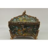 A GOOD LARGE PORCELAIN BRONZE MOUNTED CASKET AND LID decorated with exotic birds. 14ins long, 9ins