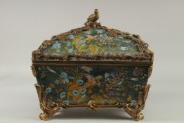 A GOOD LARGE PORCELAIN BRONZE MOUNTED CASKET AND LID decorated with exotic birds. 14ins long, 9ins