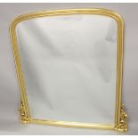 A LARGE GILTWOOD PLAIN OVER MANTLE MIRROR. 6ft high 4ft 3ins wide.