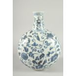 A CHINESE BLUE AND WHITE PORCELAIN MOON FLASK decorated with flower heads and scrolling vine. 31cm