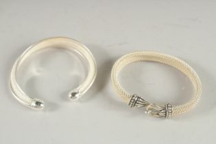 TWO SILVER BANGLES.