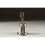 A SILVER HAND BELL. London 1898, TWO SMALL CAST FIGURES, 1.75ins and six silver circular dishes,