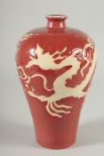 A Chinese red glazed Meiping shaped vase. 8ins high.