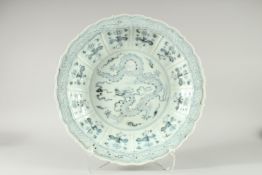 A good large Chinese blue and white dragon dish. 17ins diameter.