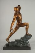 A LARGE ANATOMICAL BRONZE ATHLETE on a marble base.