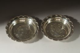 A PAIR OF CIRCULAR SILVER DISHES , 10ins diameter. Birmingham 1925. Weight 14ozs.