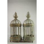 A PAIR OF COPPER AND GLASS HANGING LANTERNS 23ins long.