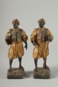 A GOOD PAIR OF 19TH CENTURY COLD PAINTED ARAB FIGURES. 9ins high.