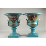 A LARGE PAIR OF SEVRES DESIGN BLUE TWO HANDLED URN SHAPED VASES with classical scenes. 18ins high.