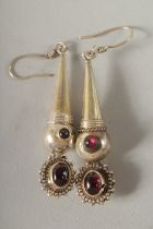 A PAIR OF SILVER AND GARNET DROP EARRINGS.