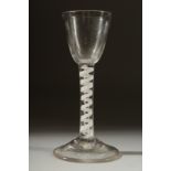A GEORGIAN GLASS with inverted plain bowl and white twist stem. 6ins high.