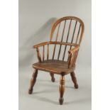 A CHILD'S WINDSOR ARM CHAIR.