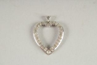 A 14CT WHITE GOLD AND DIAMOND HEART SHAPED PENDANT.