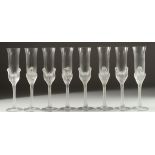 A GOOD CASED SET OF EIGHT JEAN-CLAUDE SWAN CHAMPAGNE GLASSES each 10ins long.