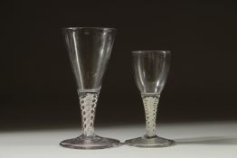 TWO SMALL GEORGIAN GLASSES both with white short stems. 4ins & 5ins high.