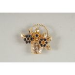A 14CT GOLD DIAMOND AND SAPPHIRE BASKET BROOCH.