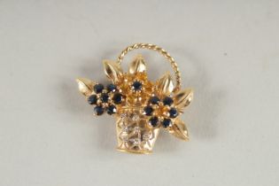 A 14CT GOLD DIAMOND AND SAPPHIRE BASKET BROOCH.