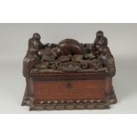 A SUPERB UNUSUAL 19TH CENTURY MAHOGANY CASKET, the top carved with pelicans on either corner and a
