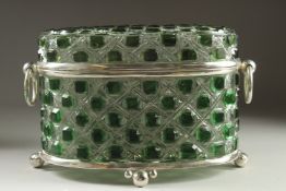 A GREEN GLASS AND SILVER PLATED OVAL CASKET with ring handles on ball feet. 14ins long.