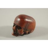 A RARE POSSIBLY 17TH CENTURY CARVED BONE SKULL. 2.25ins long, 1.5ins wide, 1.5ins high.