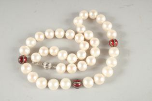 AN 18CT WHITE GOLD PEARL AND ENAMEL NECKLACE. 30ins long.