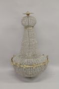 A LARGE BEAD CHANDELIER 4ft high.