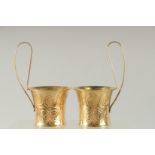 A PAIR OF LALAOUNIS SILVER GILT PUNCH CUPS