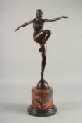 AFTER T. PHILIPP. A BRONZE DANCER. Signed, on a marble basee. 20ins high.