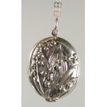 A SILVER LILY OF THE VALLEY LOCKET AND CHAIN.