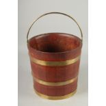 A BRASS BANDED WOODEN BUCKET. 12ins high.