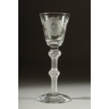 A SUPERB JACOBITE WINE GLASS the bowl engraved with roses, wtih air twist and knop stem. 6.5ins