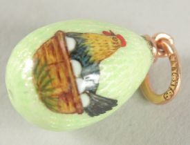 A 14CT GOLD RUSSIAN ENAMEL CHICK EGG PENDANT.