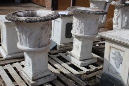 A PAIR OF ITALIAN CARVED WHITE MARBLE CAMAGNA URNS. 1ft 6ins high.