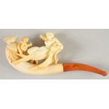 A SLIGHTLY EROTIC CARVED MEERSCHAUM PIPE by C. A. SCHWALLY, BREMEN, in a fitted leather case. A nude