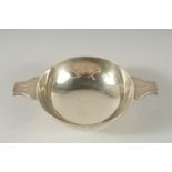 A TWO HANDLED CIRCULAR SILVER KOSCH with engraved handles. 4.5Ins diameter London 1904. Weight