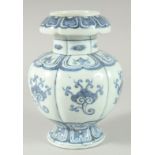 A CHINESE BLUE AND WHITE PORCELAIN FLOWER HEAD VASE with decorative motifs. 20.5cm high.