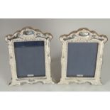 A PAIR OF SILVER PHOTOGRAPH FRAMES. 7.5ins x 5ins