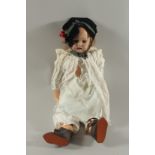 A SIMON AND HALBIG DOLL S & H 1079, 13 D E P. with bisque head and articulated body. 27ins long.
