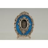 A GOOD FABERGE SILVER AND BLUE ENAMEL EASLE FRAME, in an old Faberge box. 2.75ins x 2ins.