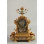 A VERY GOOD FRENCH ORMOLU AND SEVRES DESIGN CLOCK with urn finial, masks, acanthus and fruit, with